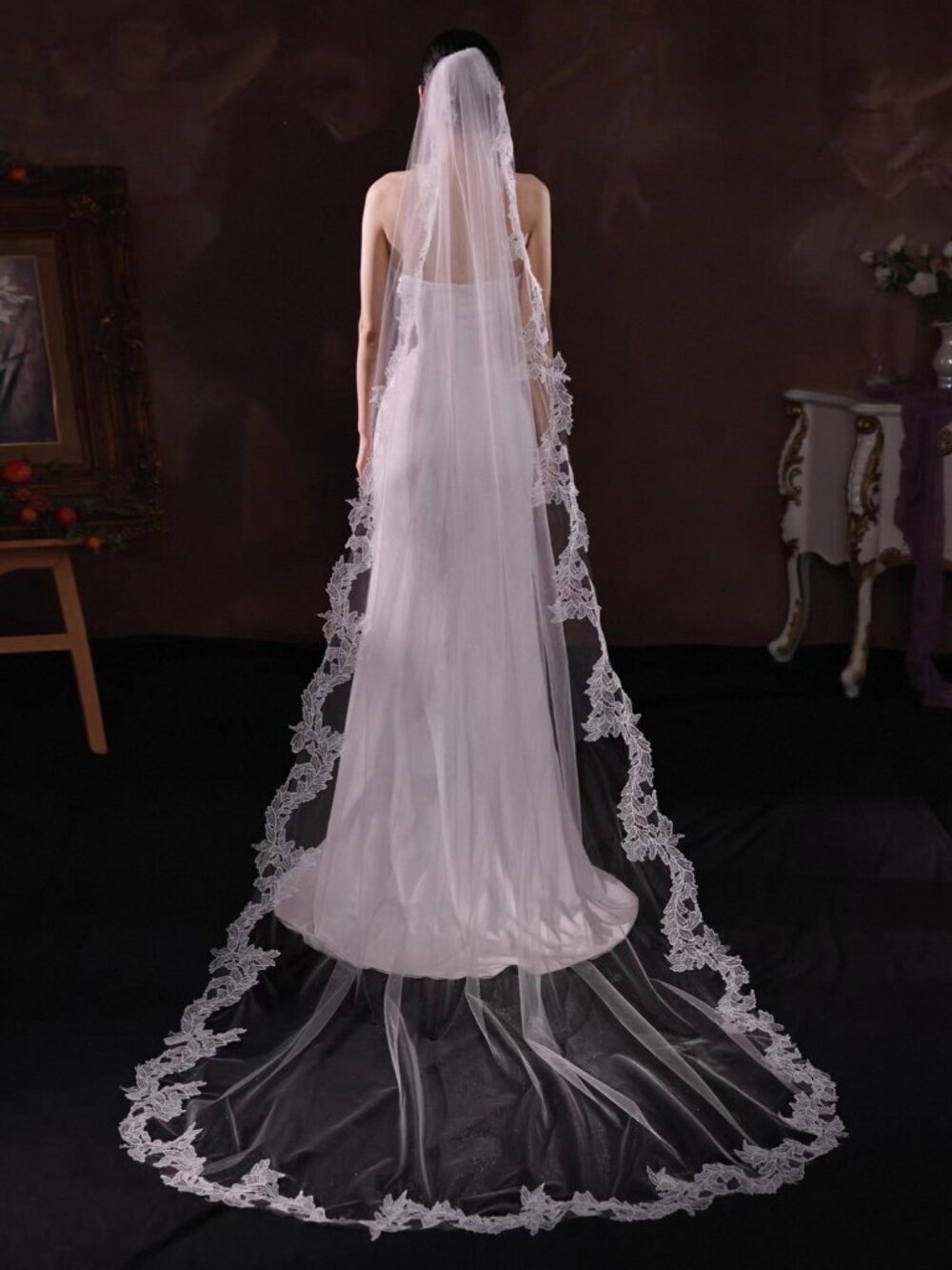 Tulle veil trimmed with structured lace. Brand new with tag and attached comb.
